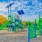 a playground with blue and green slide