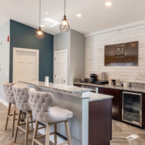 a kitchen with a marble island