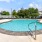 a swimming pool with a metal bar