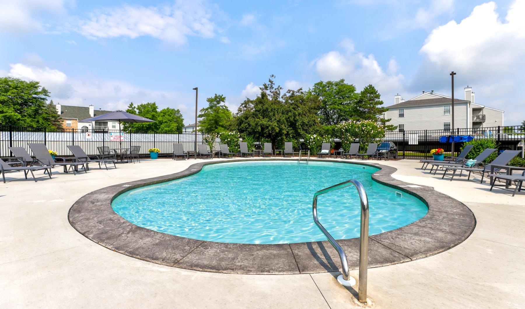 a swimming pool with a metal bar